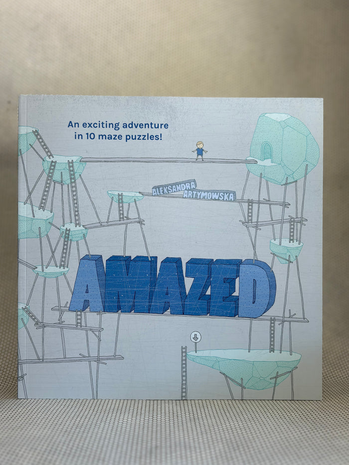 Book titled 'Amazed' with maze puzzles on a textured surface