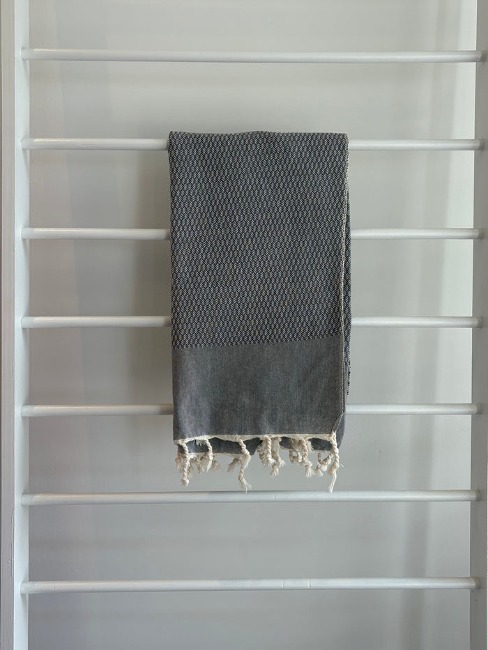 dark grey tweed weave towel.