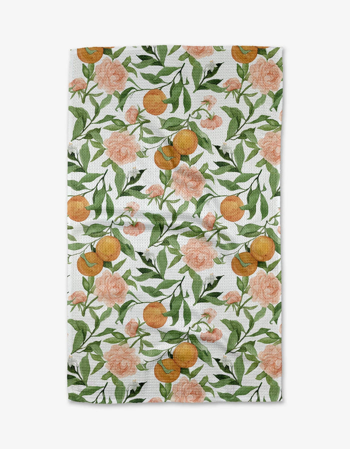 towel with floral and fruit pattern on a white background