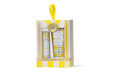 Beekman 1802 skincare set in a decorative box with yellow accents on a white background