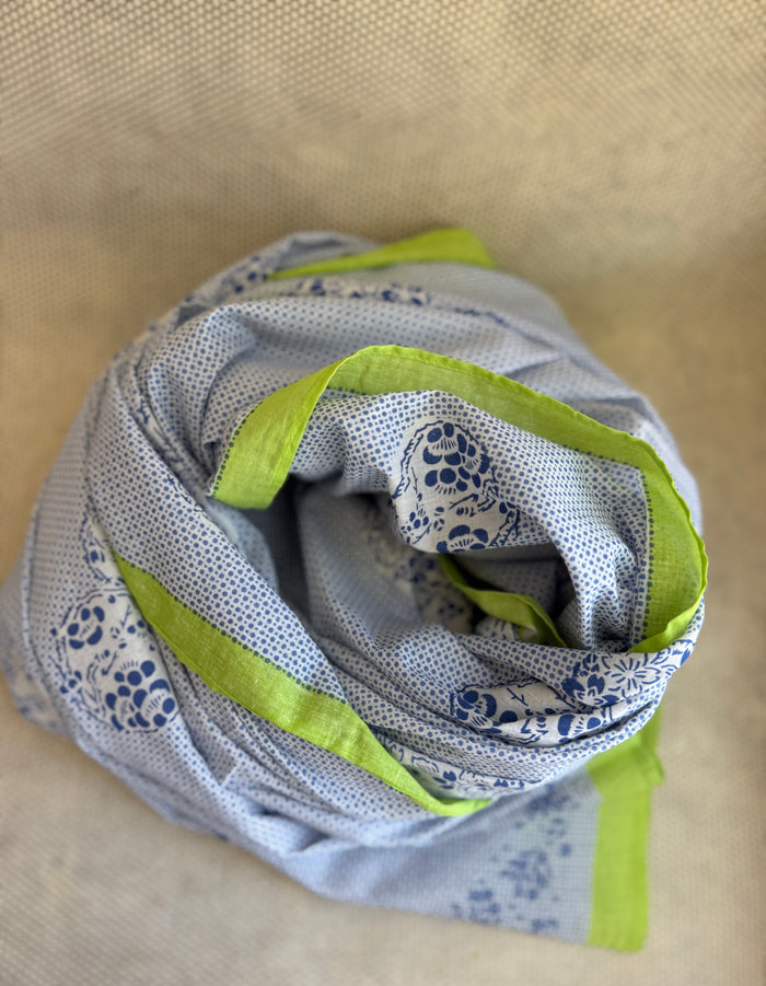 bunched lightweight scarf with green and blue design.