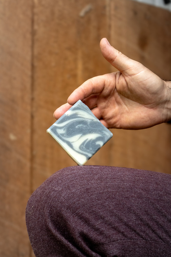Rustic Strength - Person holding a 3.5 oz Detoxifying Charcoal Bar Soap