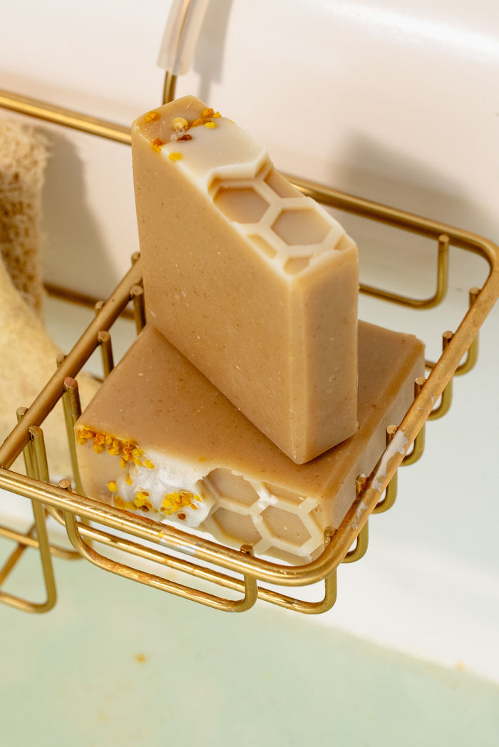 Rustic Strength - Bar Soap | 3.5 oz | Milk & Honey in a shower caddy