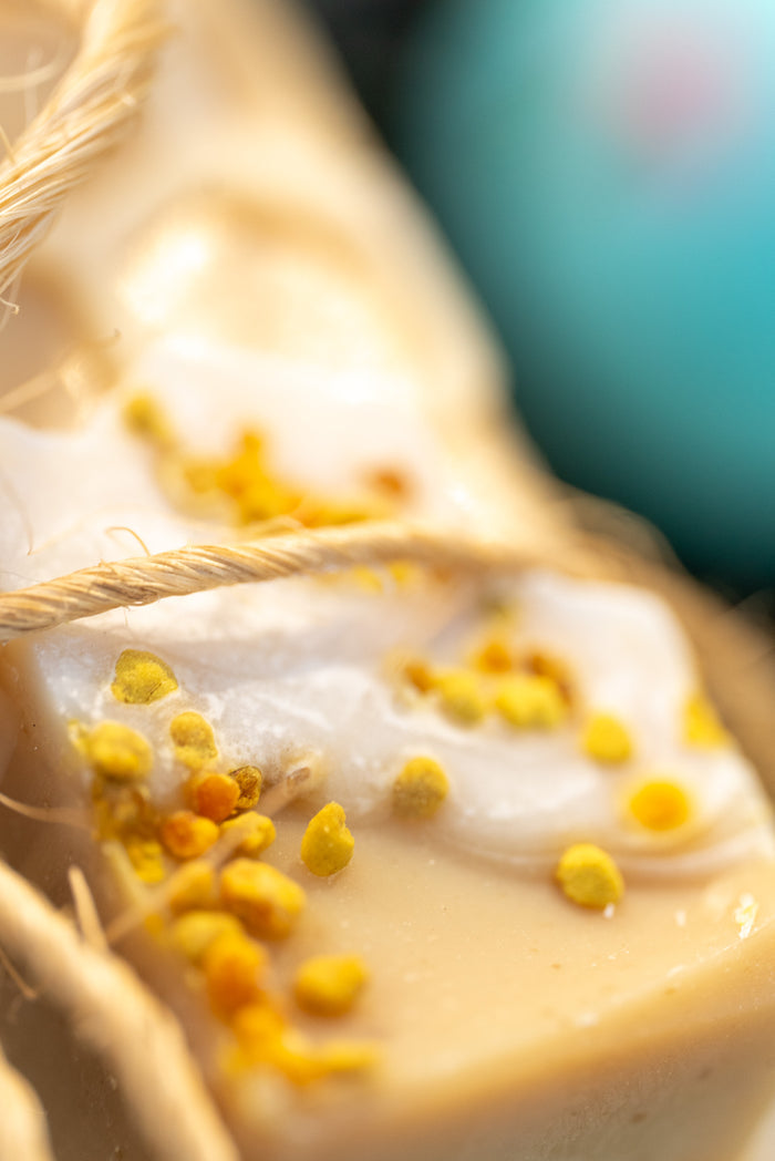 Up-Close Image: Rustic Strength - Bar Soap | 3.5 oz | Milk & Honey and twine with a blue dominant background