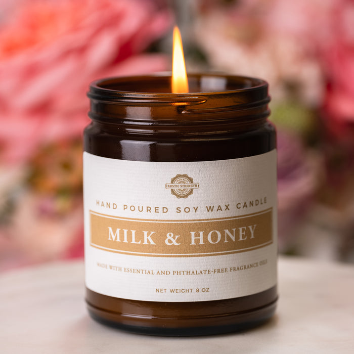 Rustic Strength, Candle, 8oz, Amber Glass, Milk & Honey, blurred pink-dominant background