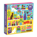 A colorful 500 piece puzzle box featuring various playful illustrations of cats, books, and household items.