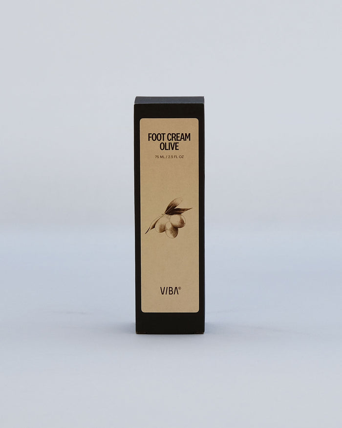 Black and tan rectangular foot cream box labeled "Foot Cream Olive" with olive branch illustration, 75 ml / 2.5 fl oz.