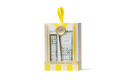 Beekman 1802 soap packaging with yellow ribbon on a white background