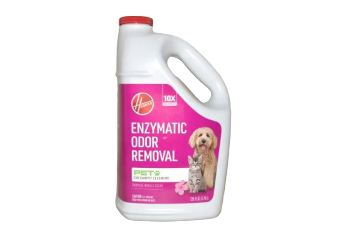 A white plastic bottle of Hoover Enzymatic Odor Removal pet carpet cleaner with a pink label and red cap, shown against a plain beige background.