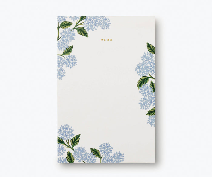 Notepad with floral design on a white background