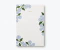 Notepad with floral design on a white background