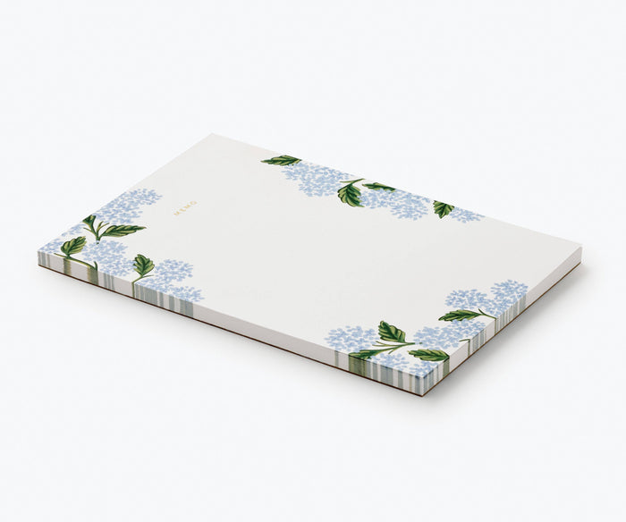 Notepad with floral design on a white background