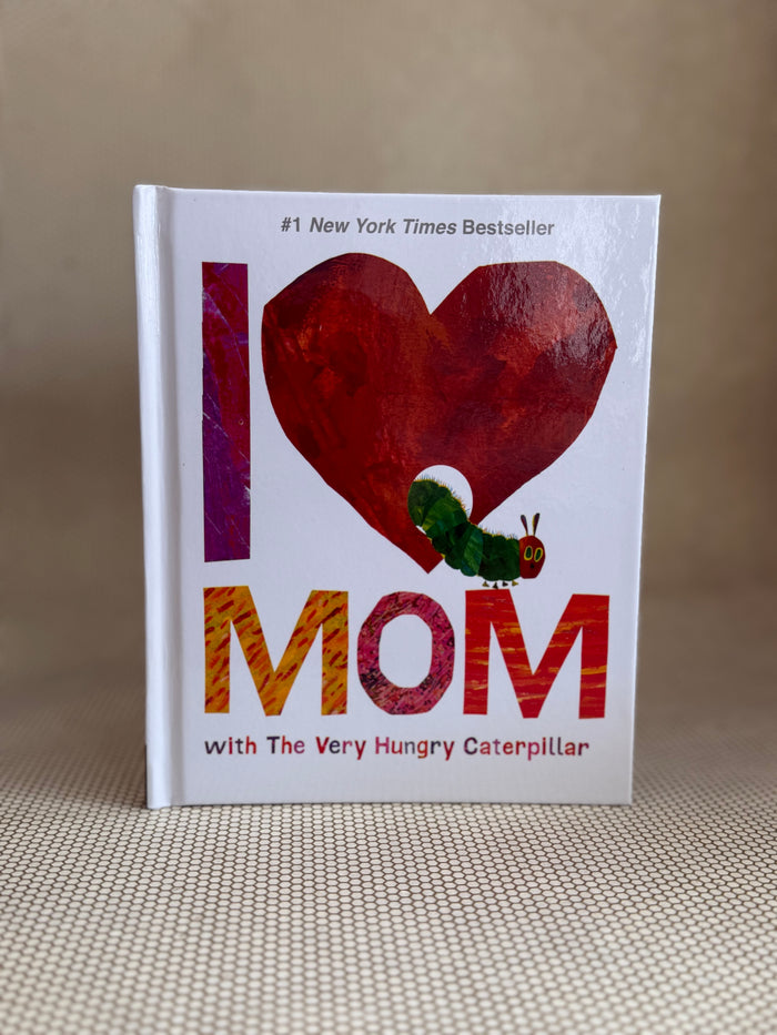 Book titled 'I ❤️ Mom with The Very Hungry Caterpillar' on a textured surface.
