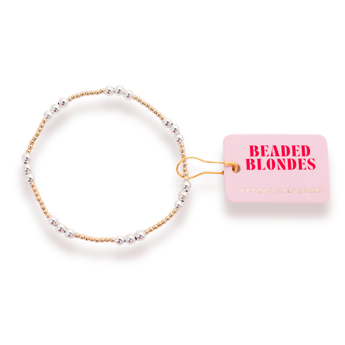 A gold-filled bracelet with silver beads and a label that reads 'BEADED BLONDES'.