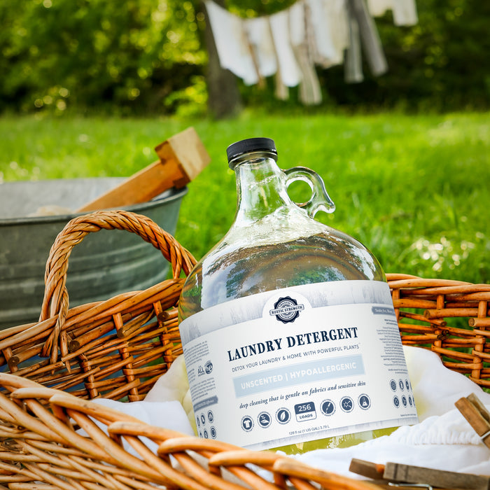 Rustic Strength - Laundry Detergent outside in a wicker basket.