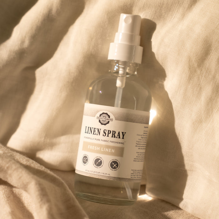 Rustic Strength - Linen Spray shown resting on linen fabric
