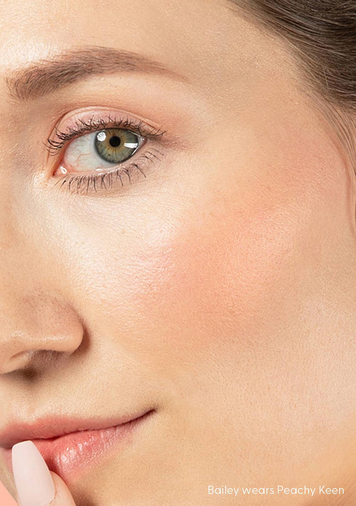 Close-up of a person's eye with a soft focus on the skin texture.