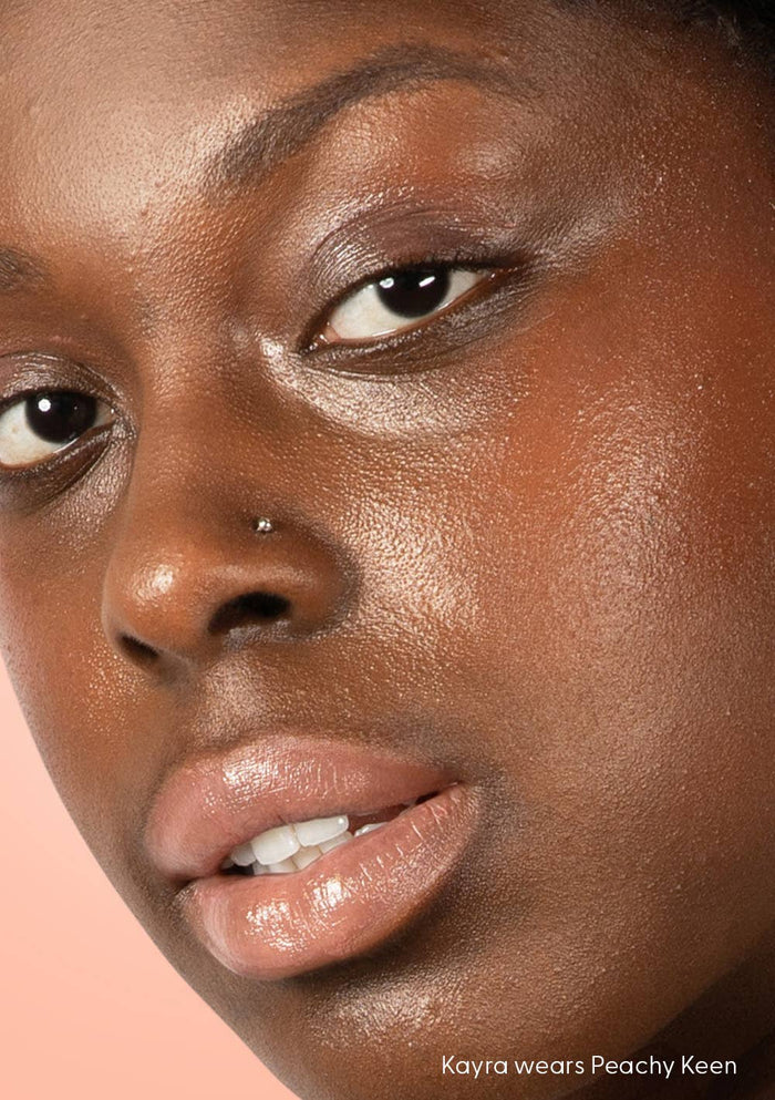 Close-up of a person's face with a neutral background