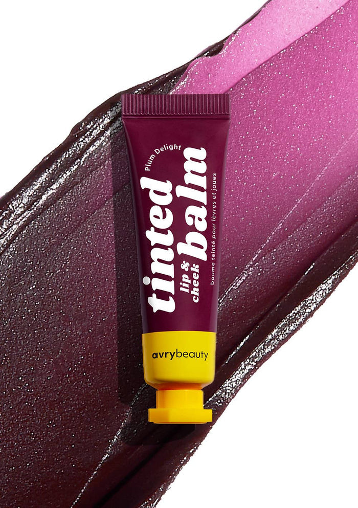 Avry Beauty tinted lip and cheek balm tube on a colorful background