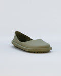 Moss-colored rubber clog with curved upper and textured sole against white background.