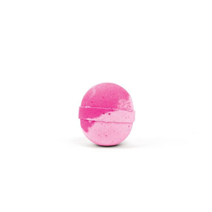 a pink bath bomb against a white background