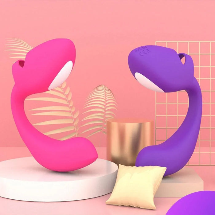 Pink and purple remote control finger vibrators for couples displayed on a pink background.