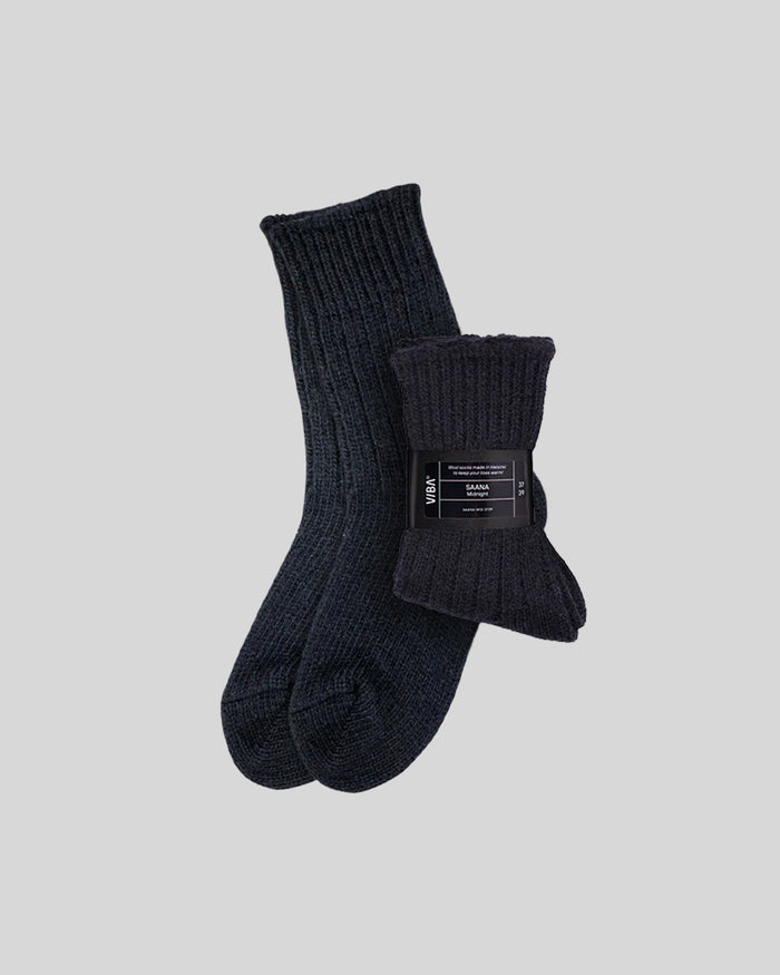 Pair of dark charcoal ribbed crew socks with rolled cuffs and brand label band.