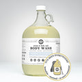 Rustic Strength, Body Wash, 1 Gallon, Glass Jug, Mama & Baby Safe, with image "I've been everywhere - Bonafide, Sanitized, Re-used Container"