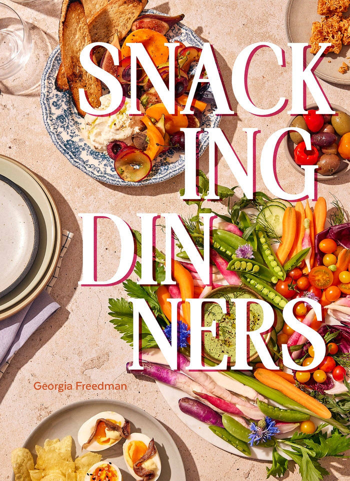 Book cover of 'Snacking Dinners' with plates of food and vegetables on a beige background.