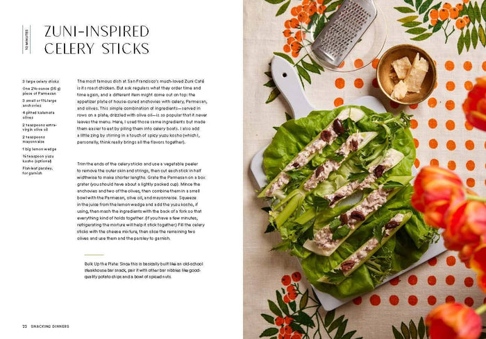 Zuni-inspired celery sticks on a cutting board with ingredients and tools on a patterned tablecloth.