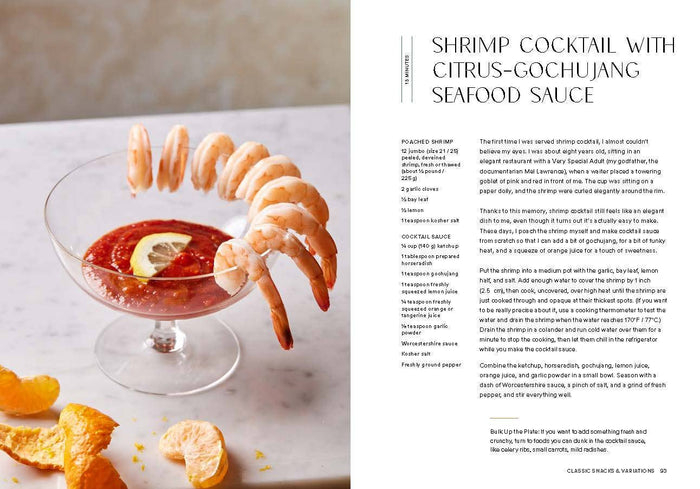 Shrimp cocktail with citrus-gochujang seafood sauce on a marble surface, accompanied by text.