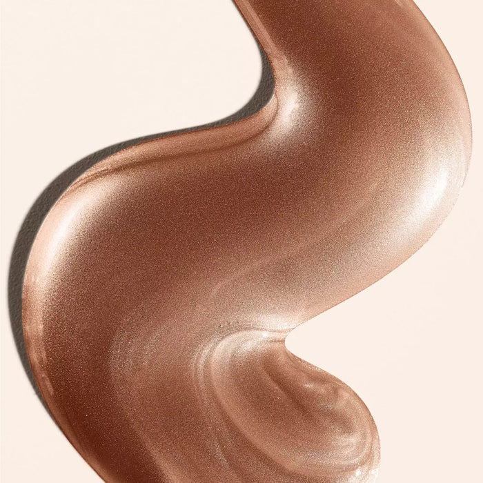 Sol de Janeiro Rio Sunset Glow Oil Motion 75ml body makeup with a shimmering, luminous finish, displayed in a clear bottle.