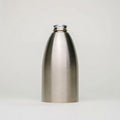 Rustic Strength, A 16oz brushed stainless steel bottle with a screw-on metal cap, centered against a light gray studio background.