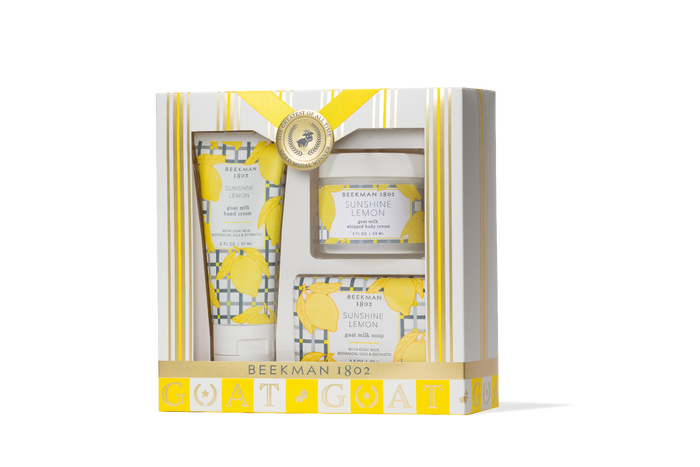 Beekman 1802 skincare set with yellow accents in a decorative box on a white background