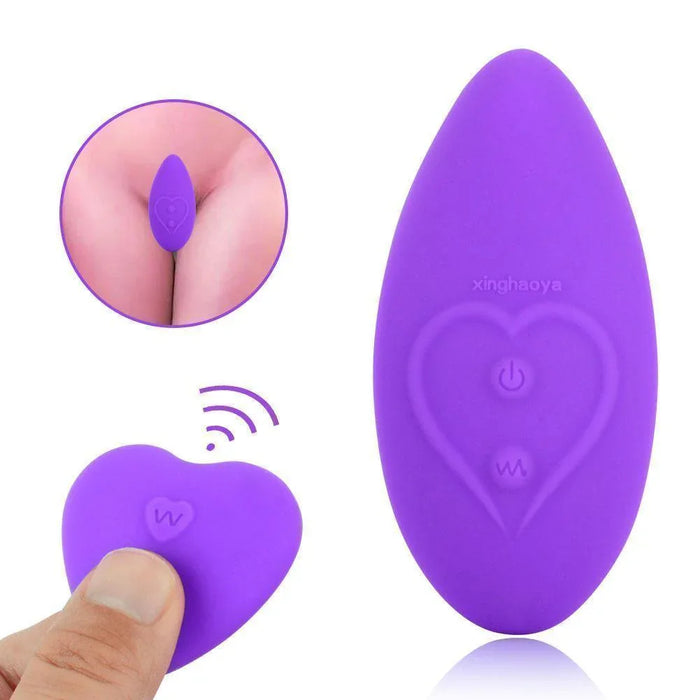Purple silicone wearable stimulator with heart design, remote control, and close-up usage inset.